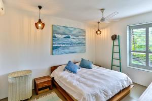 a bedroom with a bed and a ladder and a window at 18 Forest Apartments, Dunkirk Estate in Sheffield Beach +56 photos