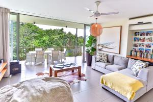 a living room with a couch and a table at 18 Forest Apartments, Dunkirk Estate in Sheffield Beach