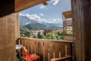 a balcony with a view of the mountains at Chasa Gisep in Scuol