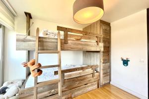 a bedroom with a bunk bed with a ladder at Beautiful 50m with a superb view of Megève in Megève
