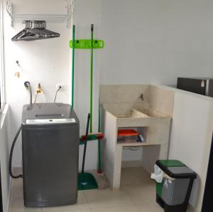 a small bathroom with a sink and a sink at GURUS FR | NUEVO apto especial para familia in Pereira