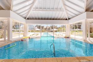 a large swimming pool with a large ceiling at Oceana Suites Green Park in Punta del Este