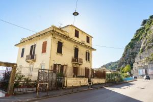 an old building on the side of a street at Palazzo Olivieri Amalfi Coast in Salerno