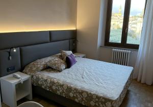 Postel nebo postele na pokoji v ubytování Hotel Continentale