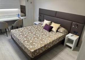 Postel nebo postele na pokoji v ubytování Hotel Continentale