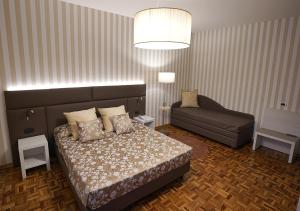 Postel nebo postele na pokoji v ubytování Hotel Continentale