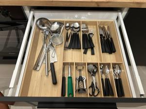 a drawer filled with utensils in a kitchen at Apartman Kvaka 22 in Bjelovar