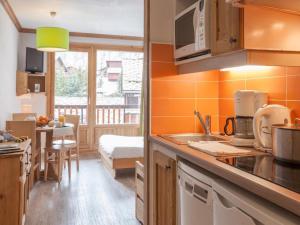 Köök või kööginurk majutusasutuses Residence & Spa Les Chalets de Solaise