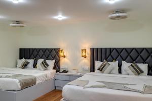 Postel nebo postele na pokoji v ubytování La baga Beach Hotel By Orion Hotels