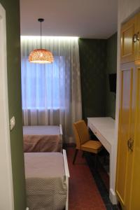 Postel nebo postele na pokoji v ubytování Artistic Tirana Blloku