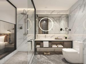 a bathroom with a toilet and a sink and a shower at Argyle Grand Hotel Nairobi Airport in Nairobi