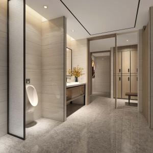 a bathroom with a toilet and a sink and a mirror at Argyle Grand Hotel Nairobi Airport in Nairobi