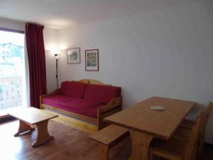 a living room with a couch and a table at Appartement Valfréjus, 3 pièces, 6 personnes - FR-1-561-20 in Valfréjus