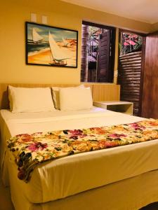 Postel nebo postele na pokoji v ubytování Hotel Pousada Latitude
