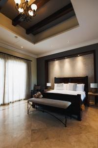 Кровать или кровати в номере Orchid House Baja