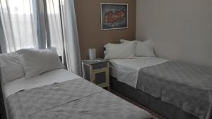 Postel nebo postele na pokoji v ubytování ΤΟ ΔΙΑΜΕΡΙΣΜΑ ΤΗΣ ΜΑΙΡΗΣ or MARY'S APARTMENT