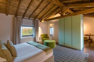a bedroom with a large bed and a window at Dimora Cottanera in Castiglione di Sicilia +79 photos