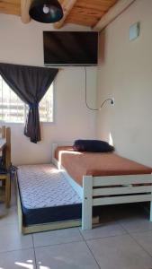 Giường trong phòng chung tại TyR departamento