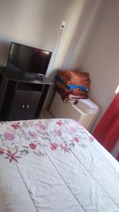 Giường trong phòng chung tại TyR departamento