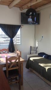 Giường trong phòng chung tại TyR departamento