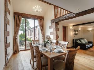 a dining room with a table and chairs at 3 bed property in Wigton 83471 in Aikton