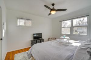 a bedroom with a bed and a ceiling fan at Chic Pueblo Vacation Rental Home Near Fairgrounds! in Pueblo