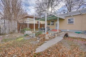 a house with a patio and a fence at Chic Pueblo Vacation Rental Home Near Fairgrounds! in Pueblo