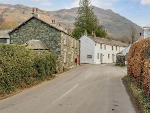 an empty street in a small village with buildings at 2 bed property in Keswick 86249 in Rosthwaite