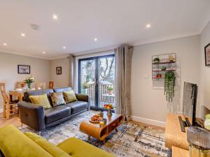 a living room with a couch and a table at 1 bed in Ilkley 87569 in Ilkley