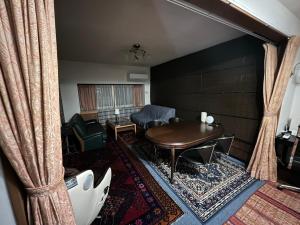 Istumisnurk majutusasutuses ゲストハウス かぶろの庭