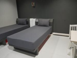 Postel nebo postele na pokoji v ubytování ภูรักษ์รีสอร์ท บ้านกรูด