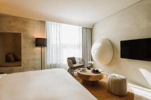 Televisyen dan/atau pusat hiburan di 了了礁溪 Vivir Jiaoxi Hotel