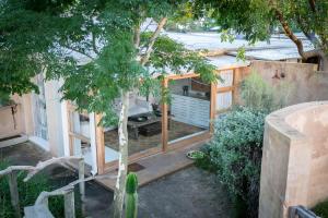 an aerial view of a house with a tree at Emily Moon River Lodge in Plettenberg Bay