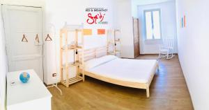 Rúm í herbergi á B&b Sà Di..