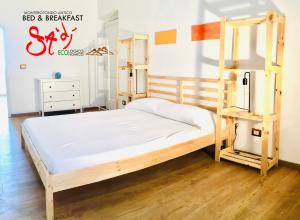 a bed and a bunk bed frame in a room at B&b Sà Di.. in Monterotondo