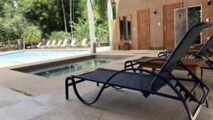 A piscina localizada em Serra do Ibitipoca Hotel de Lazer ou nos arredores