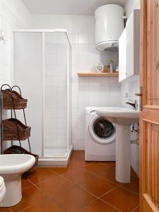 Een badkamer bij Qui e Ora House