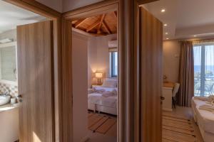 Postel nebo postele na pokoji v ubytování Mythos Villas