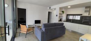 TV a/nebo společenská místnost v ubytování OD'A Apartaments