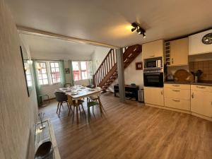 a kitchen and dining room with a table and chairs at Bayonne centre ville - Quartier historique in Bayonne