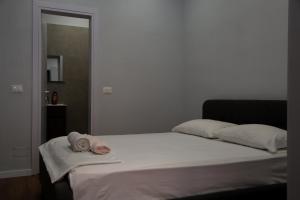 a bedroom with a bed with two towels on it at Be Solei Studio Apartments Sol 1 in Tirana