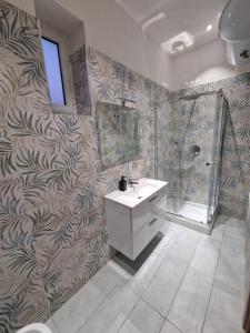 a bathroom with a sink and a shower and a mirror at Piccole Donne in Naples +121 photos