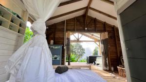 a wedding dress on a bed in a room at Chalet de Dolé in Gourbeyre