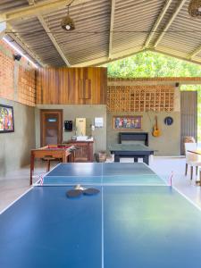 a ping pong table in a room with a ping pong ball at Rancho Litoral Búzios in Búzios