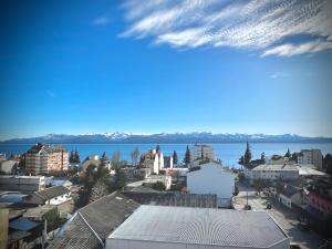 a city with a view of the water and buildings at Beautiful Apartment Downtown, Amazing Lake Views JF1 by Apartments Bariloche in San Carlos de Bariloche