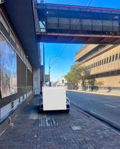 a white object sitting on the side of a street at Matcha themed Apartment in City in Johannesburg