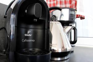 a black coffee maker sitting on a counter at Ferienhof Stärk in Bodnegg