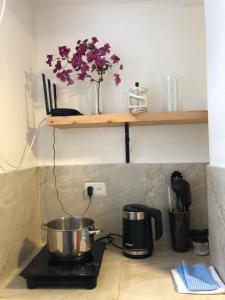 a kitchen counter with a pot on a stove at New Town Apartment 2 bedroom 1 bathroom in Baños