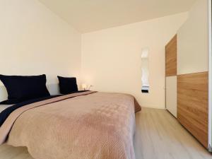 Postel nebo postele na pokoji v ubytování Künzelsau I