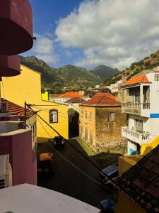 a view of a city with buildings and mountains at Bela Sombra in Vila da Ribeira Brava